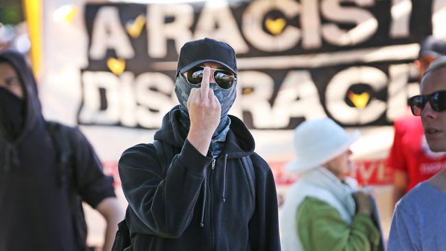 An anti-racism protester shows his disdain for the media at the Reclaim Australia Rally in Melton. Picture: Nathan Dyer