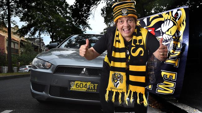 Richmond football fan, Louisa Stosur, with her personalised number plates. Picture: Tony Gough