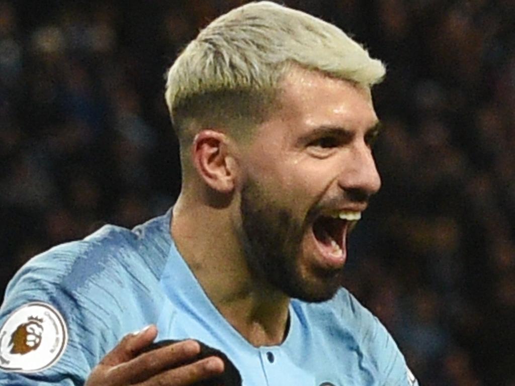 Manchester City's Argentinian striker Sergio Aguero (R) celebrates scoring their third goal to complete his hattrick during the English Premier League football match between Manchester City and Arsenal at the Etihad Stadium in Manchester, north west England, on February 3, 2019. (Photo by Oli SCARFF / AFP) / RESTRICTED TO EDITORIAL USE. No use with unauthorized audio, video, data, fixture lists, club/league logos or 'live' services. Online in-match use limited to 120 images. An additional 40 images may be used in extra time. No video emulation. Social media in-match use limited to 120 images. An additional 40 images may be used in extra time. No use in betting publications, games or single club/league/player publications. /