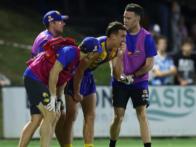 Brady Hough assisted off the field during the practice match against Fremantle. Picture: Will Russell/Getty Images