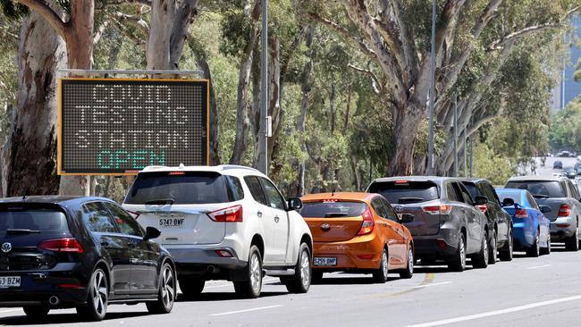 Cars queue for the COVID-19 testing facility just outside the Adelaide CBD.