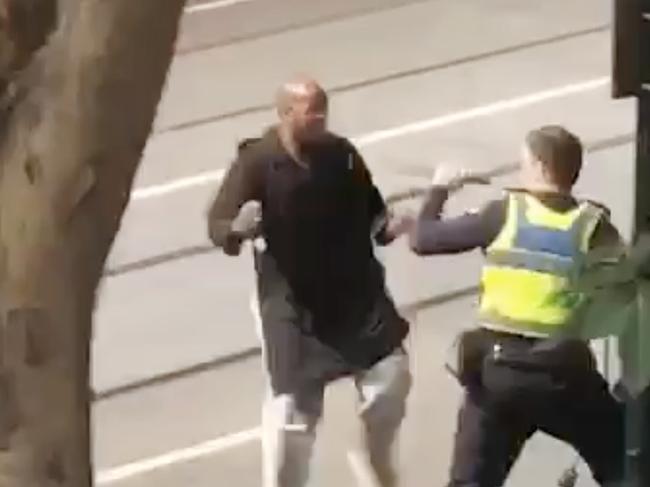 A screenshot taken from a supplied video made available to AAP on Friday, November 9, 2018 showing an incident on Bourke Street in Melbourne, Friday, November 9, 2018. (AAP Image/Supplied to AAP) NO ARCHIVING, EDITORIAL USE ONLY