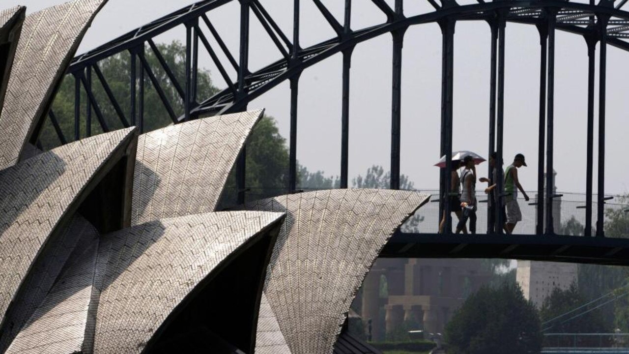 Visitors to Beijing's World Park walk across a replica of the Sydney Harbour Bridge.