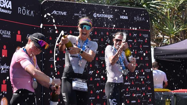 Champagne shower on the podium at the Sunshine Coast Ironman 70.3 2023.