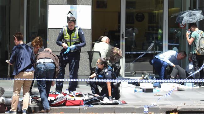 Emergency workers scramble to deal with the injured in the aftermath Picture. Tony Gough