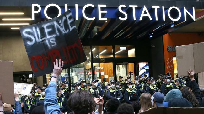 Police watched on as the protest made its way through the streets of Melbourne yesterday. Picture: Wayne Ludbey