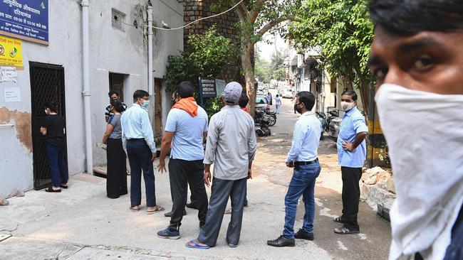 People stand in a queue as they wait to get tested for COVID-19 in New Delhi on Wednesday. Picture: AFP