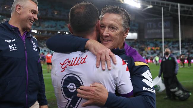 Craig Bellamy and champion hooker Cameron Smith celebrate their premiership win last season.