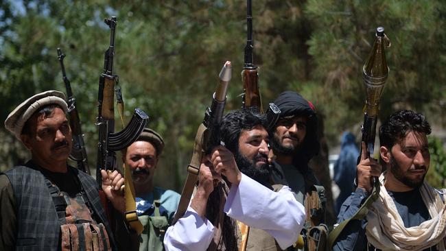 People gather with their heavy weapons to support Afghanistan security forces against the Taliban, in Guzara district, Herat province on June 23. Picture: Hoshang Hashimi / AFP