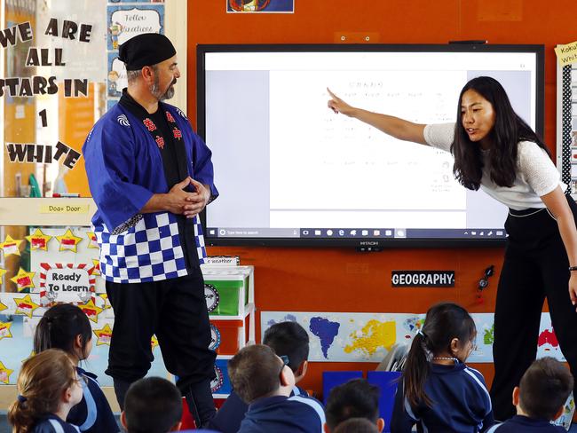 Year 1 students at St Brigid's Catholic Primary School in Marrickville learn on smart whiteboards from Sensei Peter White and Yoko Otake learning Japanese. Picture: Sam Ruttyn