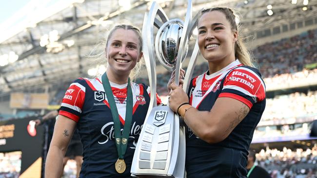 Tarryn Aiken and Isabelle Kelly of Roosters with the NRLW premiership trophy. Picture: Quinn Rooney/Getty Images