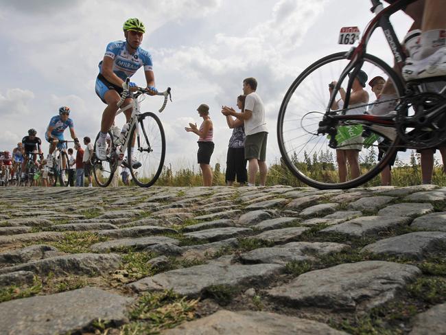 Tour de France riders cross a cobblestone section during the third stage. There’ll soon be more to come.