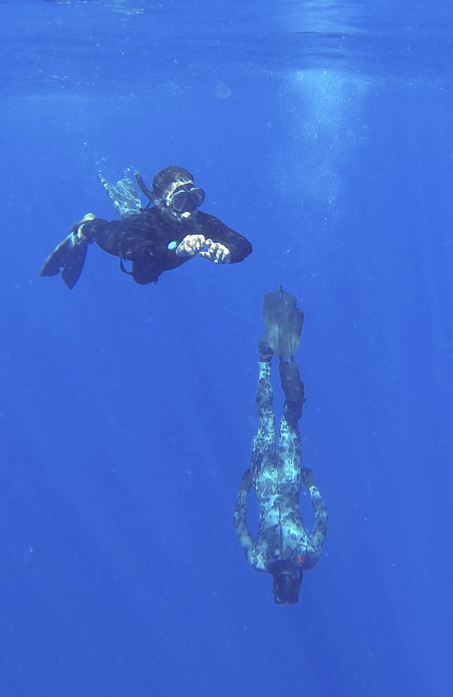 Able seaman clearance divers Matthew Johnston and Michael Arnold search the water for MH370 debris in the days after it vanished with 239 people on board.