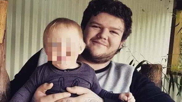 Alleged Burnie murder victim Bobby William Medcraft, 23, pictured with his young son. Picture: Facebook