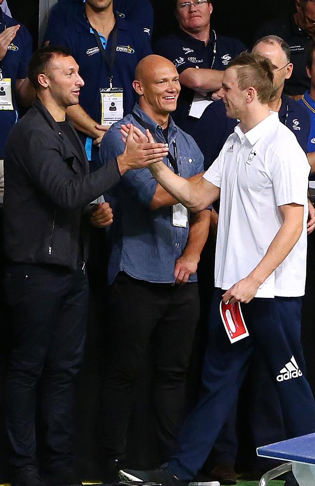 Ian Thorpe and Michael Klim congratulate Kyle Chalmers on his selection in the Rio team. Picture Sarah Reed