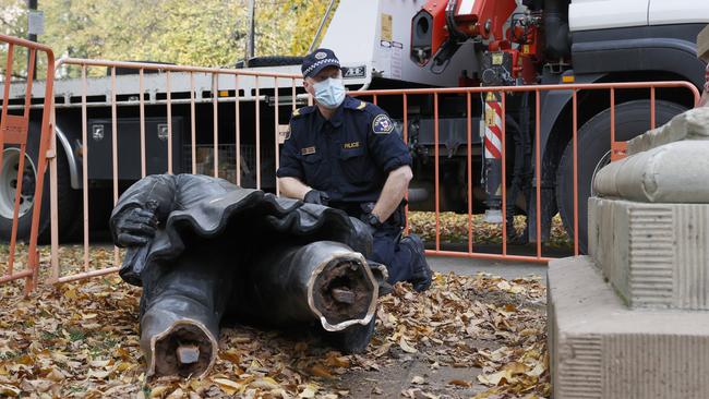 Tasmania Police in attendance gathering evidence. The William Crowther statue in Franklin Square Hobart has been vandalised overnight resulting in the statue being removed from it's plinth and then removed by Hobart City Council. Picture: Nikki Davis-Jones