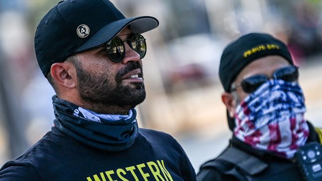 Enrique Tarrio, left, joins a counter-protest in Miami in 2021 where people gathered to remember George Floyd on the first anniversary of the black man’s death at the hands of a Minneapolis policeman. Picture: AFP