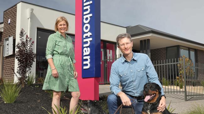 Hickinbotham Group managing director Michael Hickinbotham and sister Ruth Vagnarelli at their Clover Park display home, with dogs, Checkers and Goldie. 28 March 2020. (AAP Image/Dean Martin)