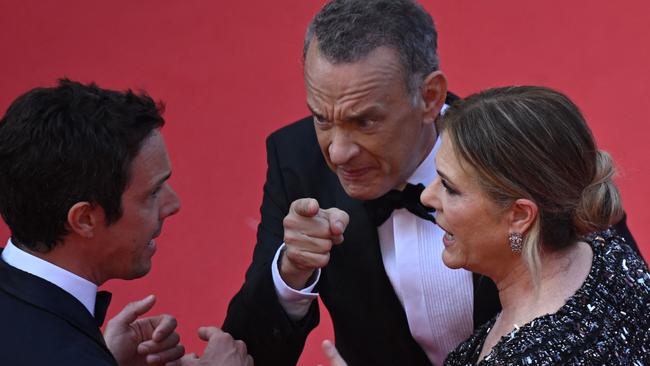 Tom Hanks and Rita Wilson argue with a staff member as they arrive for the screening of the film Asteroid City during the Cannes Film Festival. Picture: Antonin Thuillier/AFP