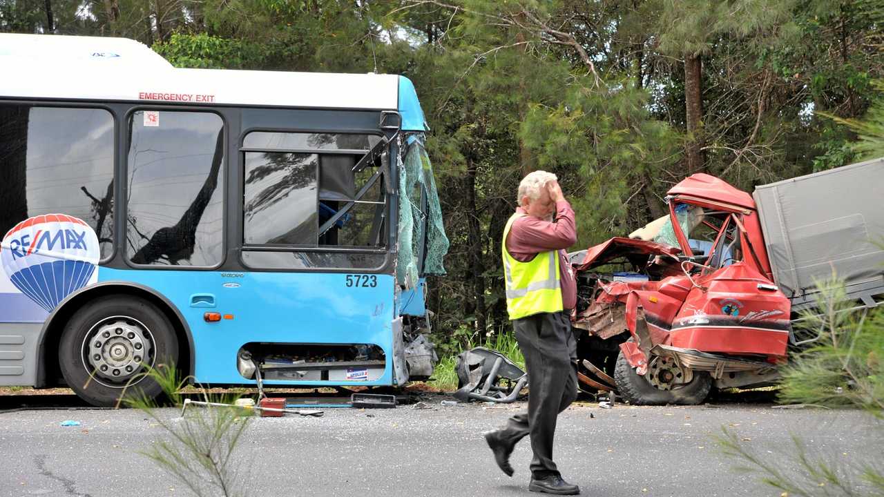 Sunbus operations manager Bob Carney walks past the scene of a head-on crash between a bus and ute that killed bus driver Bruce Kent. Picture: Brett Wortman/181270