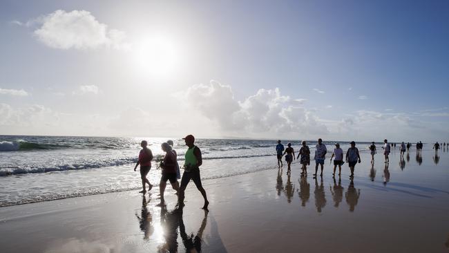 Bribie Island locals gather to pay tribute to 17-year-old local Charlie Zmuda who was killed in a shark attack at Woorim Beach on Monday afternoon. Picture: Lachie Millard