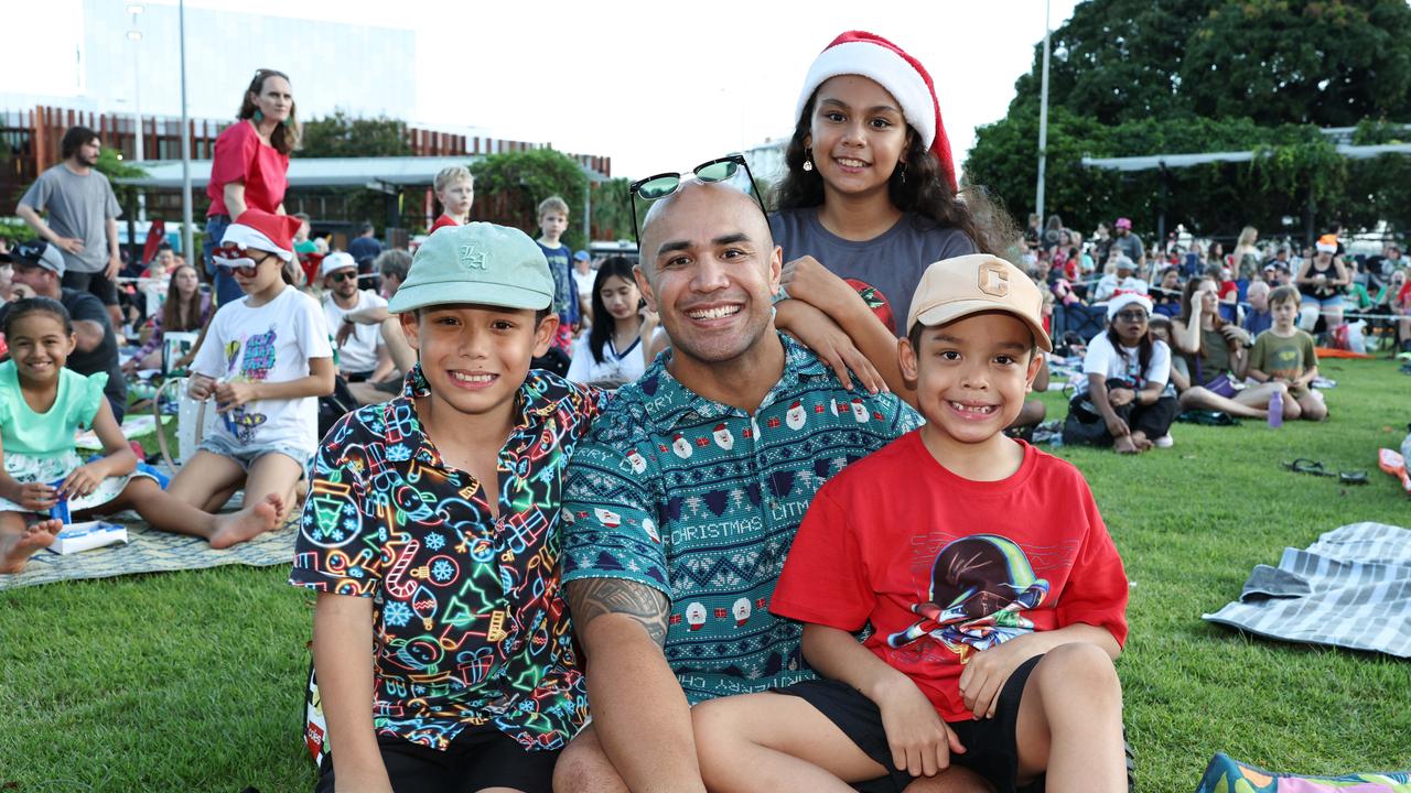 Abel Silulu, 8, Vinny Silulu, Isla Silulu, 10, and Obie Silulu, 7, at the Carols in the Park, held at Munro Martin Parklands. Picture: Brendan Radke