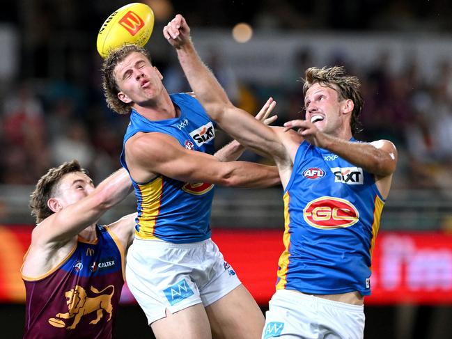 Jack Lukosius and Jed Walter compete for a mark against Brisbane. Picture: Bradley Kanaris/Getty Images