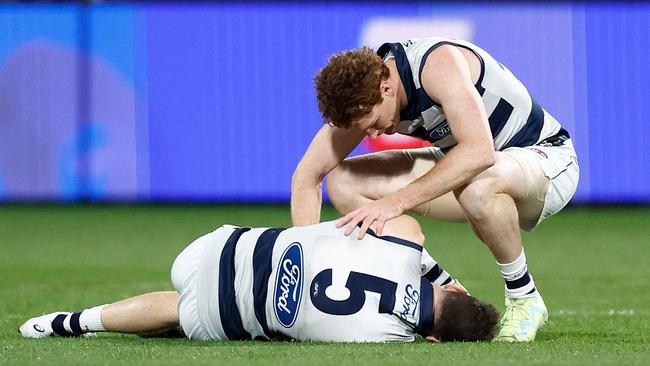 GEELONG, AUSTRALIA - JUNE 22: Jeremy Cameron of the Cats and Gary Rohan of the Cats are seen as  Cameron lays injured during the 2023 AFL Round 15 match between the Geelong Cats and the Melbourne Demons at GMHBA Stadium on June 22, 2023 in Geelong, Australia. (Photo by Michael Willson/AFL Photos via Getty Images)