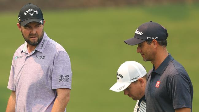 Mark Leishman (left) with Adam Scott on Tuesday during a practice round for the Australian Open. Sydney. Picture: Brett Costello