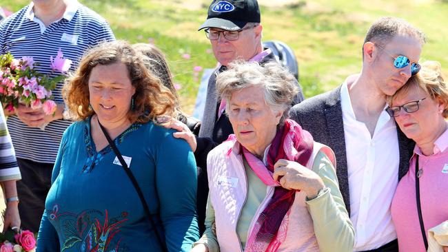 From left, Shanelle Dawson, daughter of Chris and Lyn Dawson, Lyn's siblings Gregg Simms and Pat Jenkins, Greg's son Craig Simms comforting his mother Merylin Simms at the Walk For Lyn at Long Reef Headland Lookout on Sydney's Northern Beaches. Picture: Hollie Adams