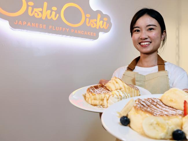 Oishi Oishi is a new eatery on the Cairns Esplanade selling Japanese pancakes, desserts and coffee. Oishi Oishi chef Miranda Lee serves up two dishes of Japanese fluffy pancakes to hungry customers. Picture: Brendan Radke