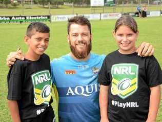 Titans' player Matt Robinson with Tweed twins Jyungarah Pearce, 11 and Kiala Pearce, 11 at the Titans' NRL School Holiday Footy Clinic at Cudgen Fields on Tuesday, April 19. Picture: Daniel McKenzie