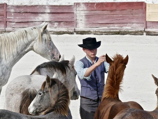 Paul Laurent with Camargue horses, France For Tauck Provence / Burgundy river cruise Photo: Kendall Hill Fee applies, single use, must credit