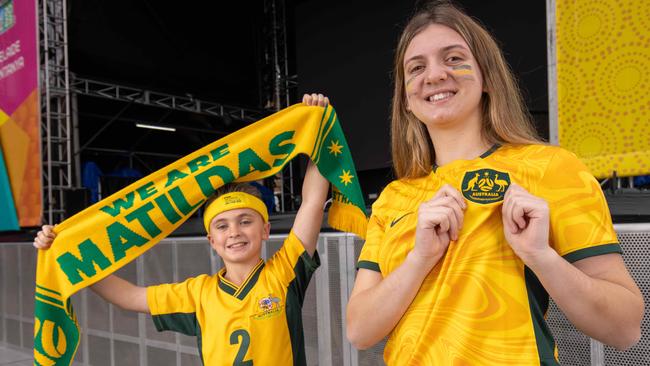 Carla and brother Alex at the FIFA Fan Festival with her Matildas scarf in Adelaide CBD.