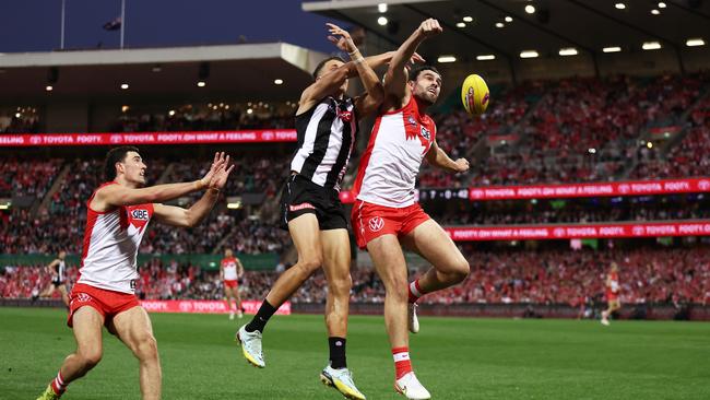 Paddy McCartin spoils the ball away from Collingwood’s Ash Johnson on Saturday. Picture: Matt King/AFL Photos