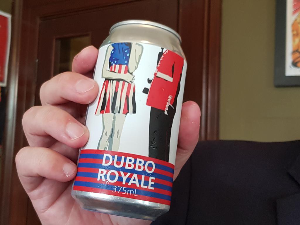 Dubbo mayor with a can of Dubbo Royale lager.