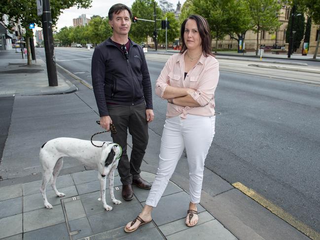 Chris Dix and Mel Haynes and their dog Spicy at the corner of Austin St and North Tce where they were abused by signage road workers for turning left out of Austin St – there were no roadworks signs at this intersection. Picture: Mark Brake