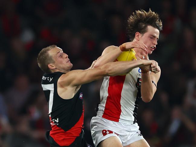 Matteas Phillipou flies for a mark against Mason Redman. Picture: Quinn Rooney/Getty Images