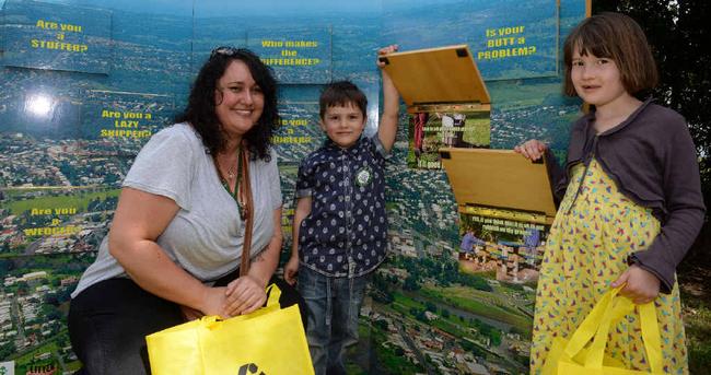 LEARNING EARLY: Amelia White with her children Chester Eliott, 4, and Cleopatra Eliott, 7, learning about recycling at the Litter-Free Lunch. Picture: Mireille Merlet-Shaw