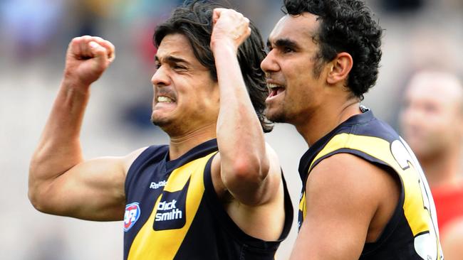 Jordan McMahon and Richard Tambling celebrate the winning goal against Melbourne, which would ultimately deliver Dusty to the Tigers.