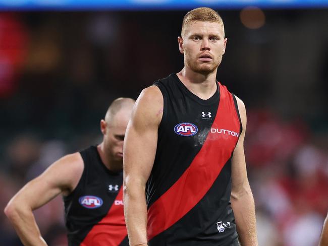 SYDNEY, AUSTRALIA - MARCH 23:  Peter Wright of the Bombers and team mates look dejected after the round two AFL match between Sydney Swans and Essendon Bombers at SCG, on March 23, 2024, in Sydney, Australia. (Photo by Matt King/AFL Photos/via Getty Images )