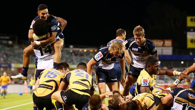 The Brumbies celebrate a try by Robbie Abel at GIO Stadium.