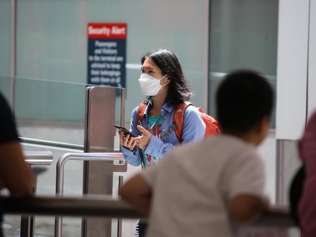 SYDNEY, AUSTRALIA - Newswire Photos JANUARY 02, 2022: People are seen arriving at the Sydney International Airport arrivals terminal, off a Cathay Pacific flight from Hong Kong after Australia set new Covid entry rules for travellers entering the country from China. The government is reportedly considering testing plane waste water on affected flights also. Picture: NCA Newswire / Gaye Gerard