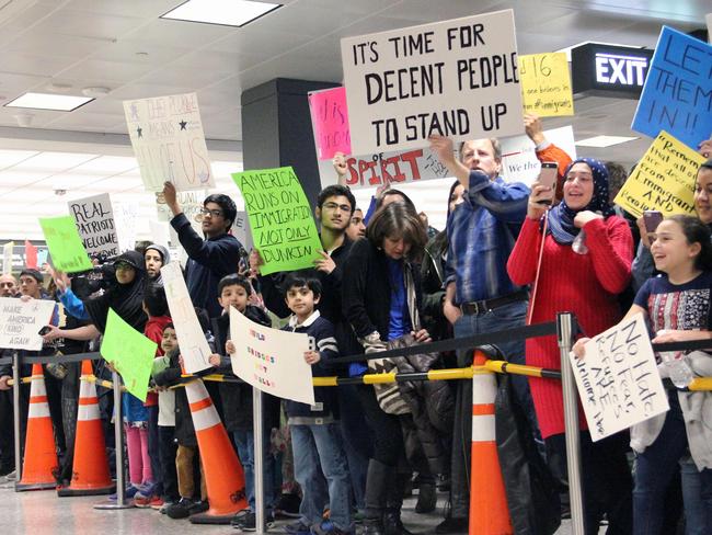 Protesters gather at the international arrivals area of the Washington Dulles International Airport in Sterling, Virginia. Picture: AFP