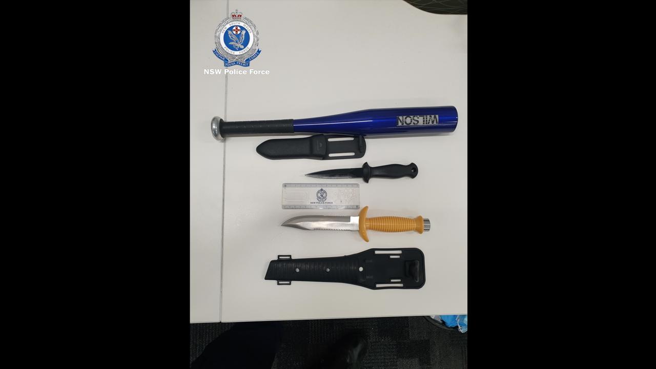 A baton and numerous knives seized during the operation. Picture: NSW Police