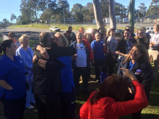 'Win for the community': Central Coast Opposition spokesman David Harris is embraced by a health worker last week after leading a successful campaign to keep Wyong Hospital in public hands.