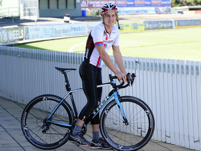 Port Adelaide’s Sam Colquhoun on the bike he’ll use to help recover from a knee reconstruction. Picture: Mark Brake