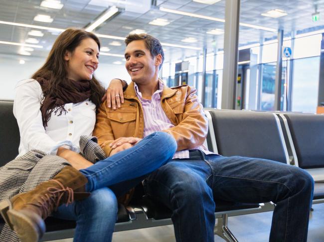 A couple waiting at the airport before they go on holiday. Picture: iStock.