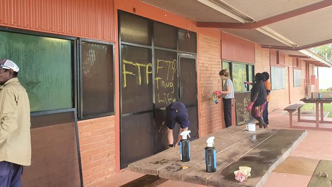 Locals cleaning up the Maningrida Arts and Culture Centre after it was broken into by youths on January 6. Picture: Supplied