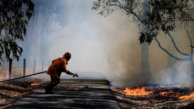 Losing ground: CFA members are not only battling fires, but an Andrews Government push to take their territory. Picture: Alex Coppel